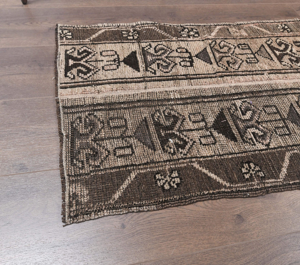 Ikat desenli patchwork vintage yolluk – turuncu ve kahverengi tonlarda yün dokuma