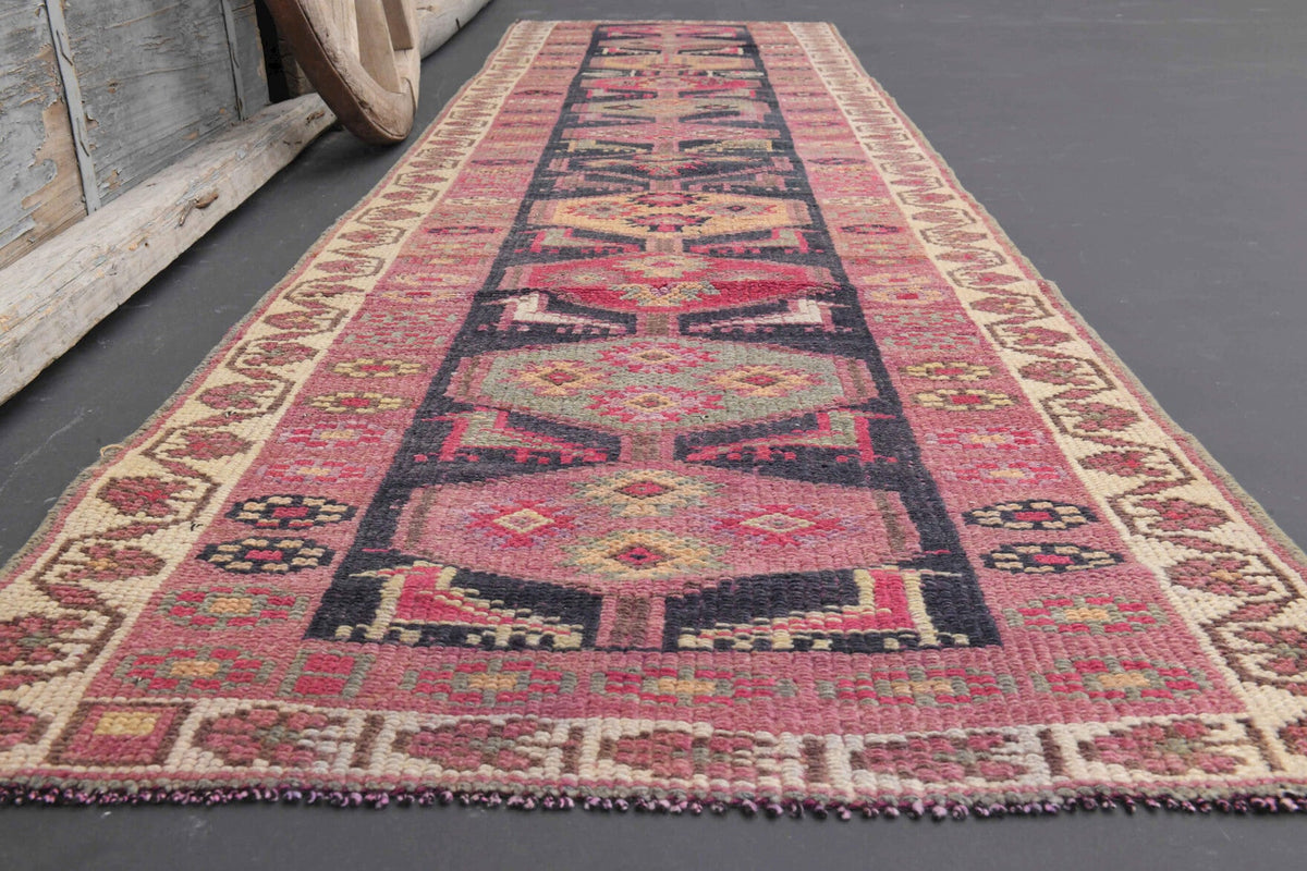 Tribal desenli el dokuma vintage yolluk – turuncu, pembe ve kırmızı tonlarda yün dokuma