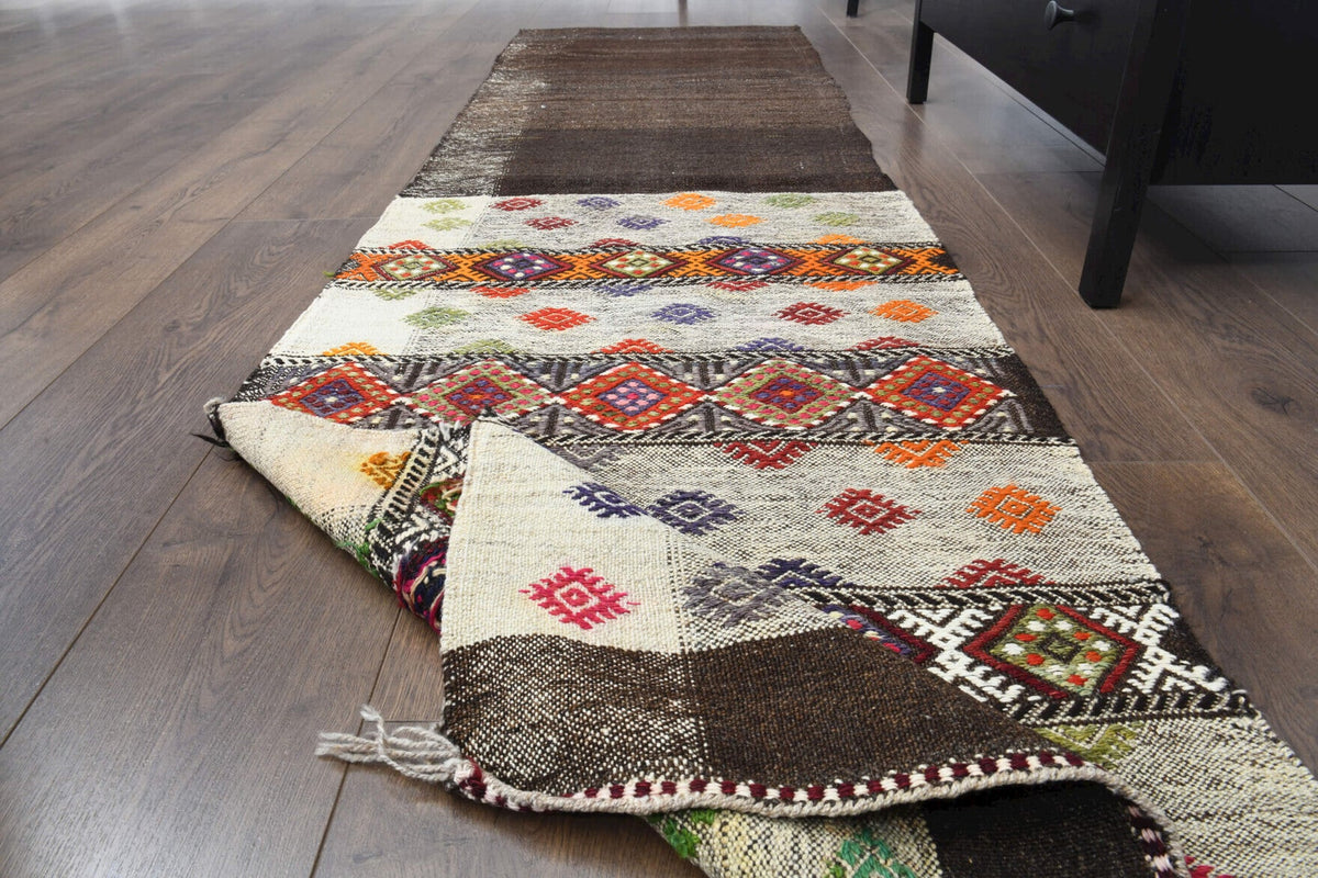 El yapımı vintage halı 61x213 cm tribal desenli yün - yakın çekim doku detayı