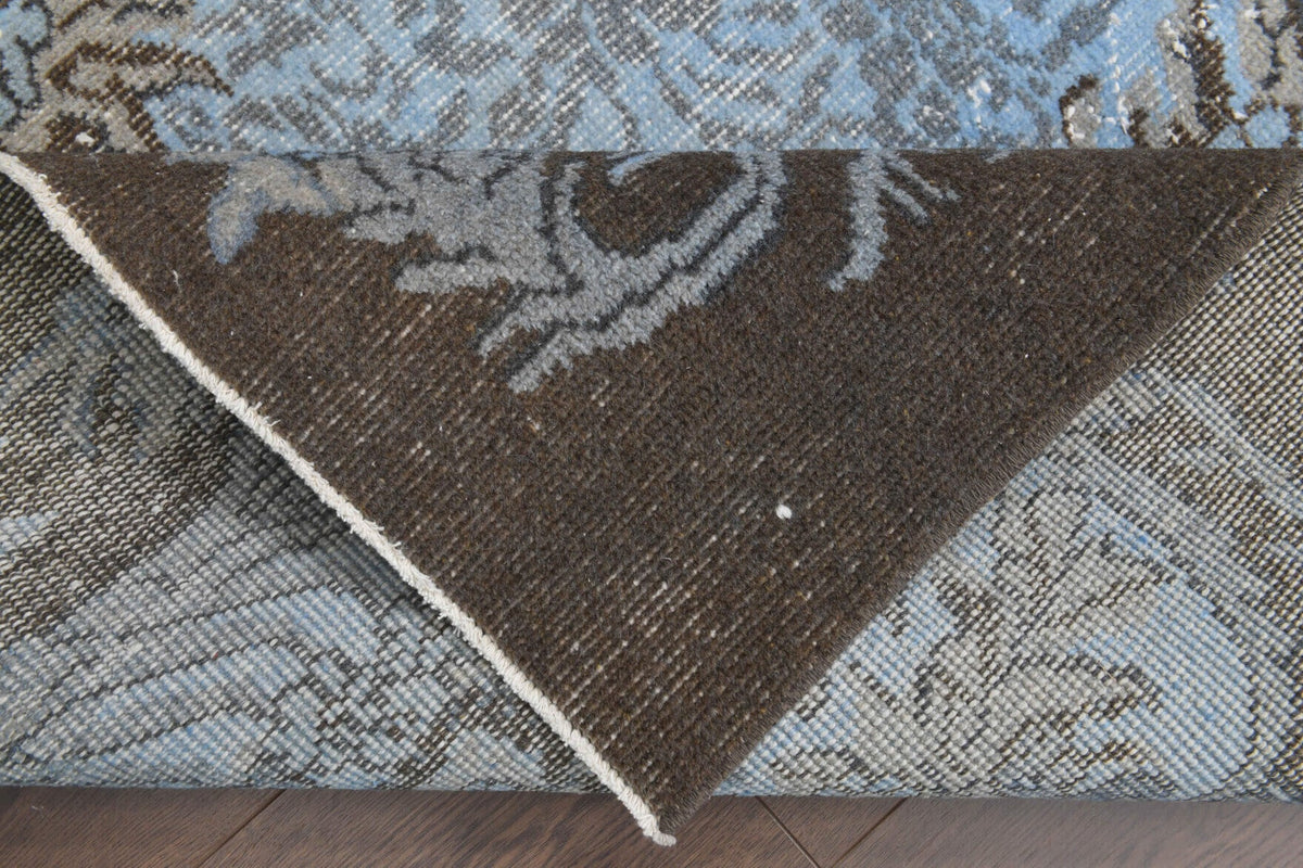 El yapımı vintage halı 180x279 cm oryantal desenli yün - ışık altında renk detayı