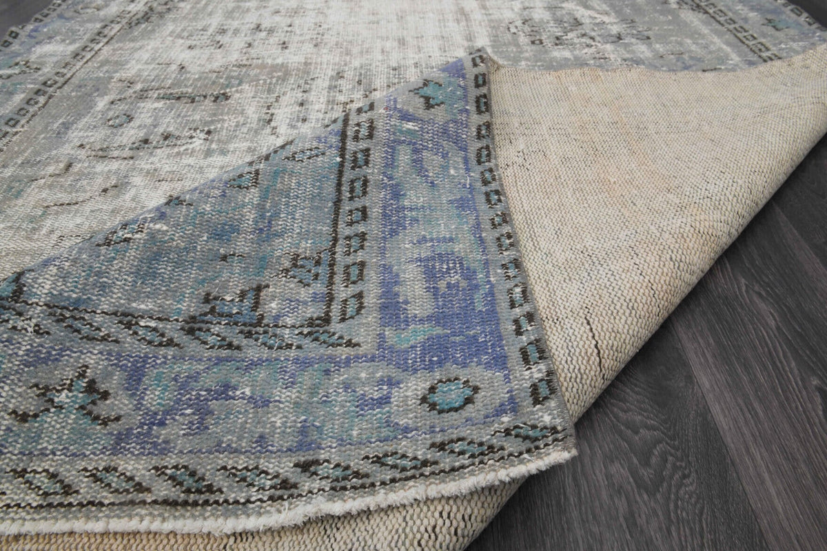 El yapımı vintage halı 170x287 cm oryantal desenli yün - ışık altında renk detayı