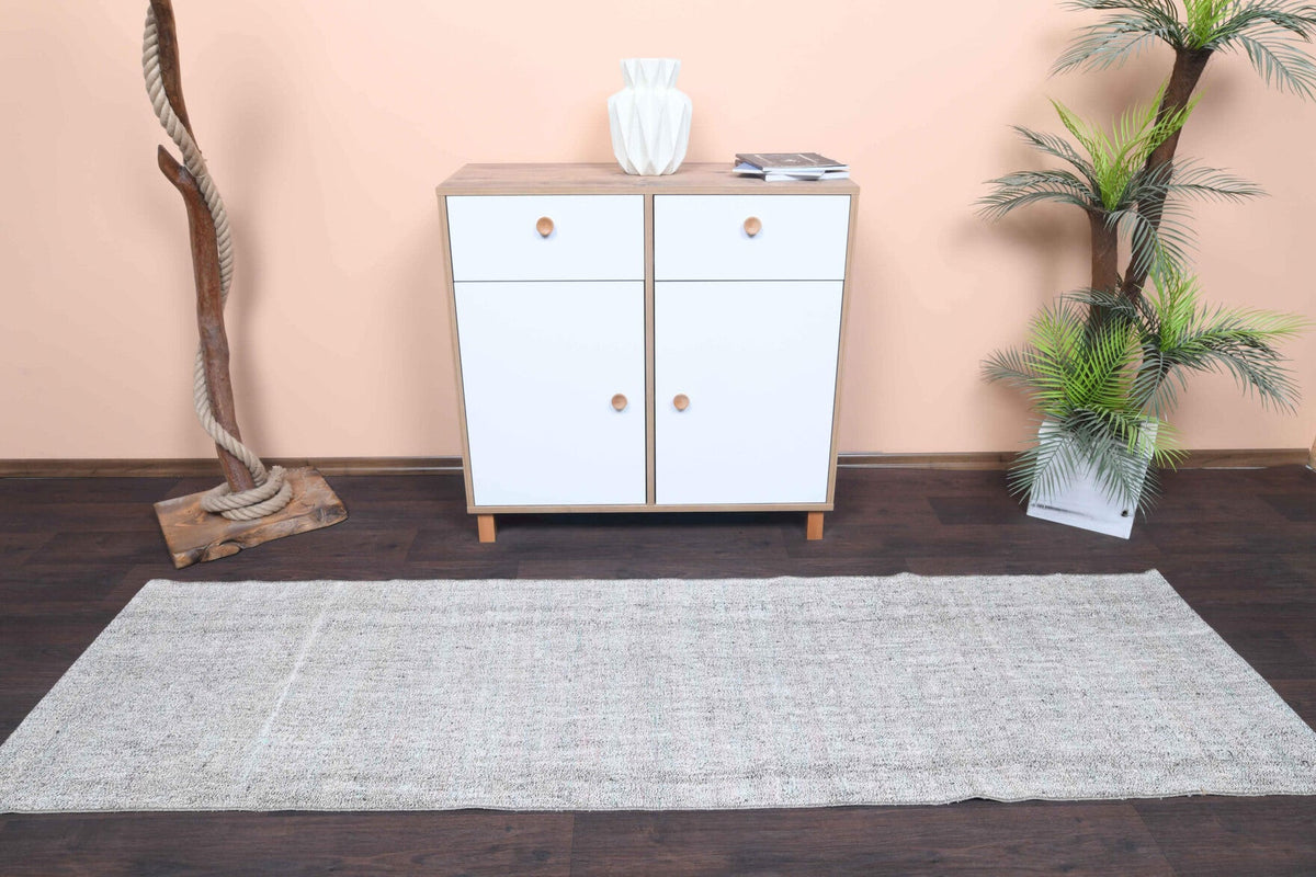 El yapımı vintage yolluk 74x244 cm düz desenli yün - yakın çekim doku detayı